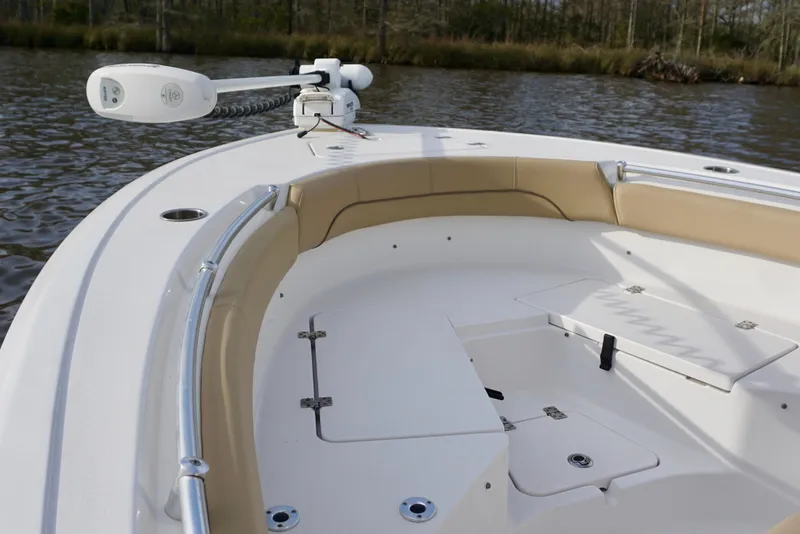 Slide: The Image of 2017 Sportsman Heritage 211 Center Console boat interior with cushioned seating and storage. - 5