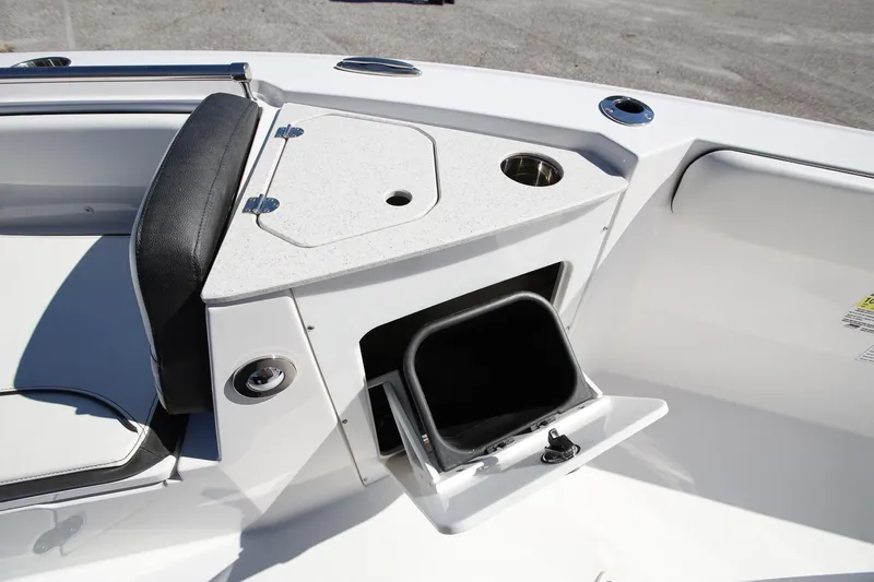 Slide: The Image of 2025 Stingray 216 CC boat interior with storage compartment and seating. - 19