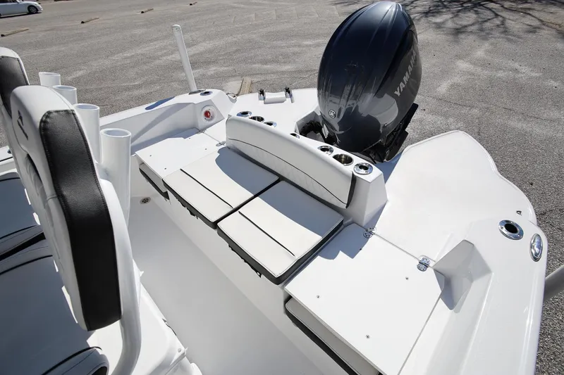 Slide: The Image of 2025 Stingray 216 CC boat interior with Yamaha engine, featuring seating and storage. - 6