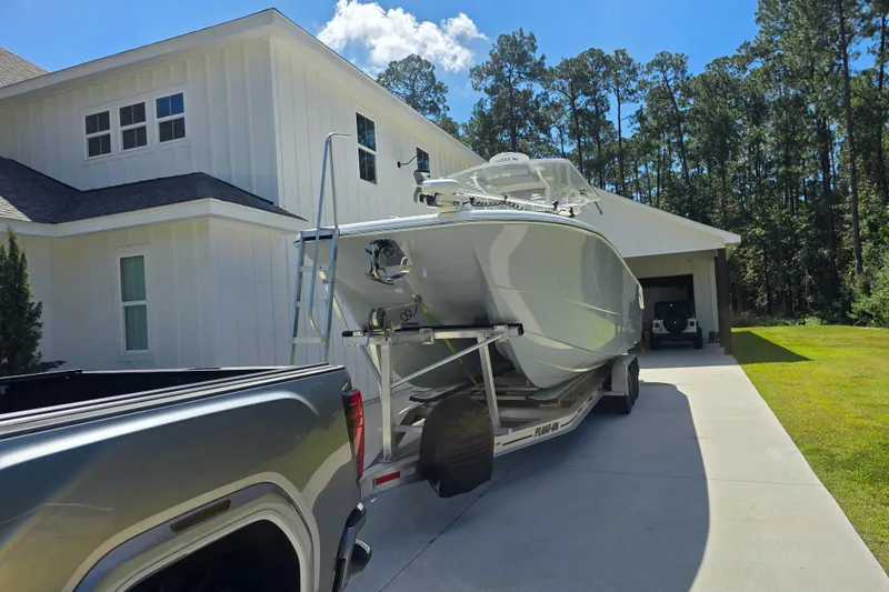 Slide: The Image of 2022 Invincible 33 Catamaran with dual Mercury 400 engines on trailer. - 11