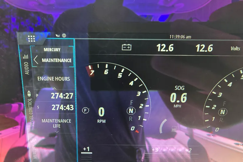 Slide: The Image of 2022 Invincible 33 Catamaran interior with storage compartments and seating. - 26