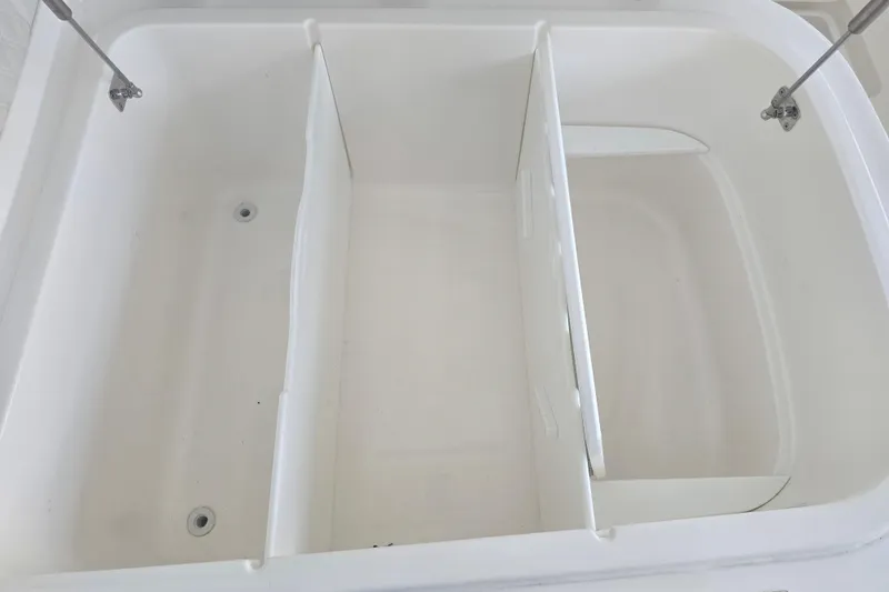 Slide: The Image of Open storage compartment on 2022 Invincible 33 Catamaran boat. - 43