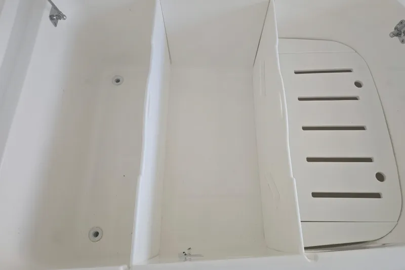 Slide: The Image of Open storage compartment on 2022 Invincible 33 Catamaran boat deck. - 44