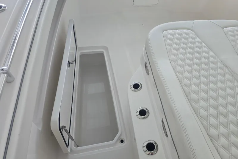 Slide: The Image of Speakers on 2022 Invincible 33 Catamaran, white interior detail. - 45