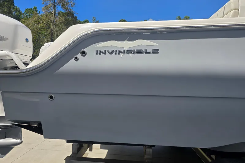 Slide: The Image of 2022 Invincible 33 Catamaran with Mercury Verado engine on trailer. - 8