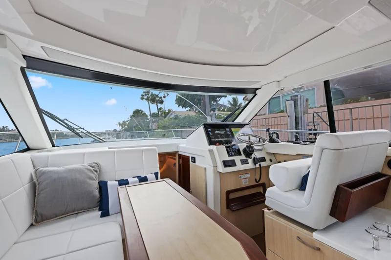 Slide: The Image of Luxurious interior of 2024 Regal 38 XO yacht with modern helm and seating area. - 18