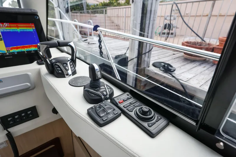 Slide: The Image of 2024 Regal 38 XO helm controls with advanced navigation technology. - 22