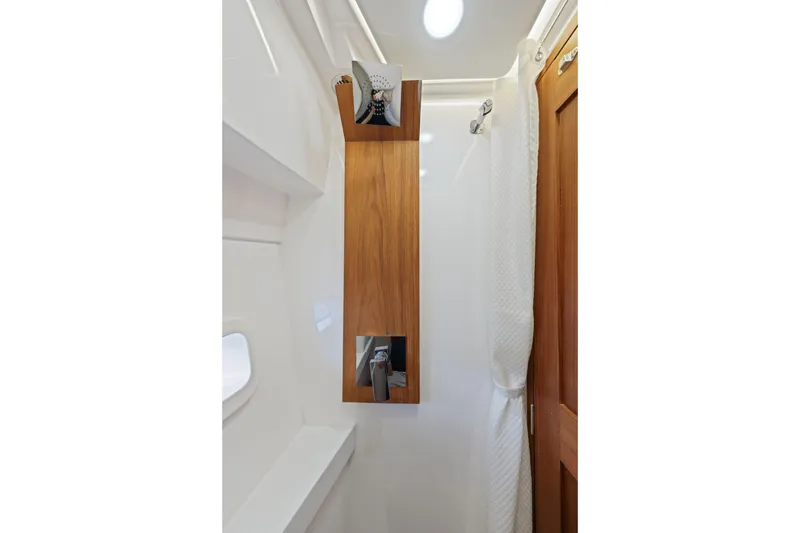 Slide: The Image of 2024 Regal 38 XO yacht bathroom with wooden accents and modern fixtures. - 30