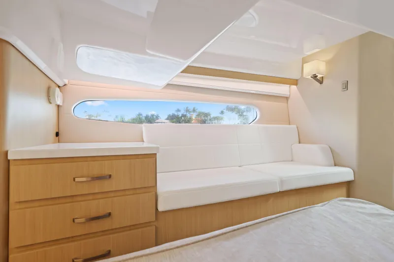Slide: The Image of 2024 Regal 38 XO yacht interior with modern seating and natural light. - 32