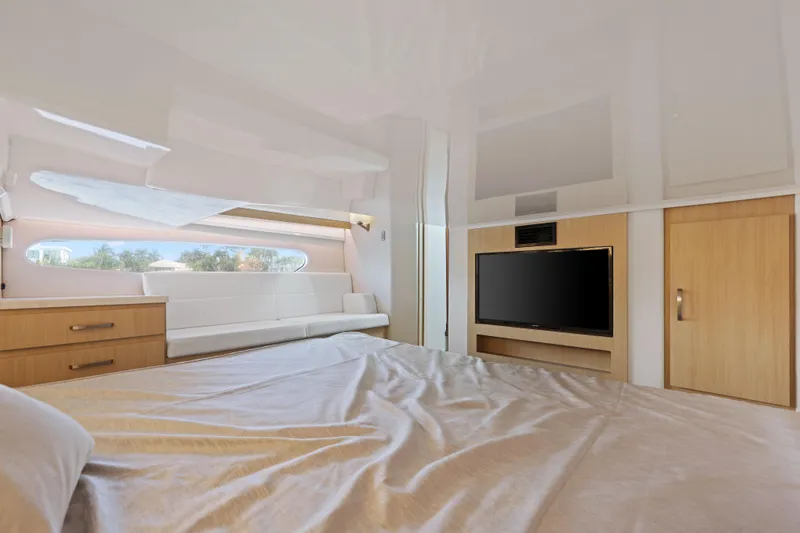 Slide: The Image of Luxurious interior of 2024 Regal 38 XO yacht with modern furnishings and large window. - 33