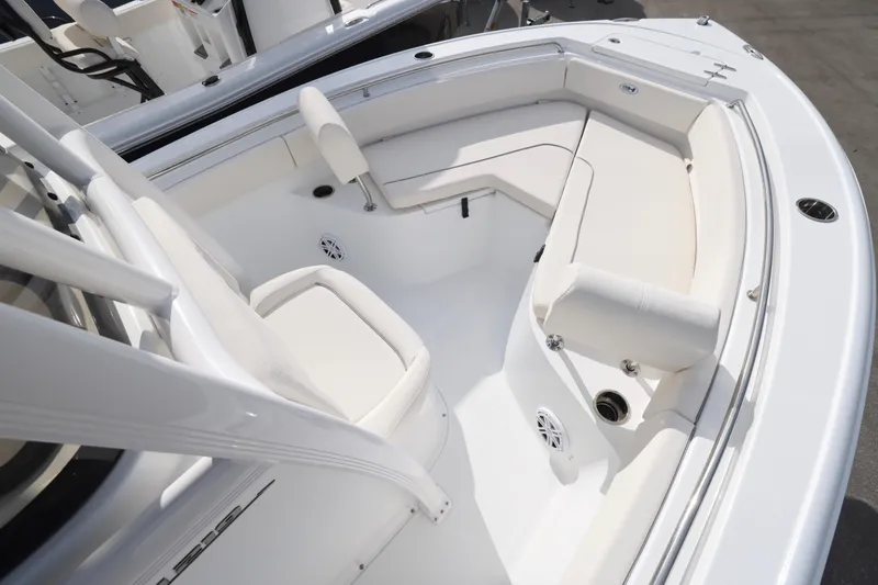 Slide: The Image of 2026 Sea Hunt Ultra 219 boat interior with white seating and modern design. - 2