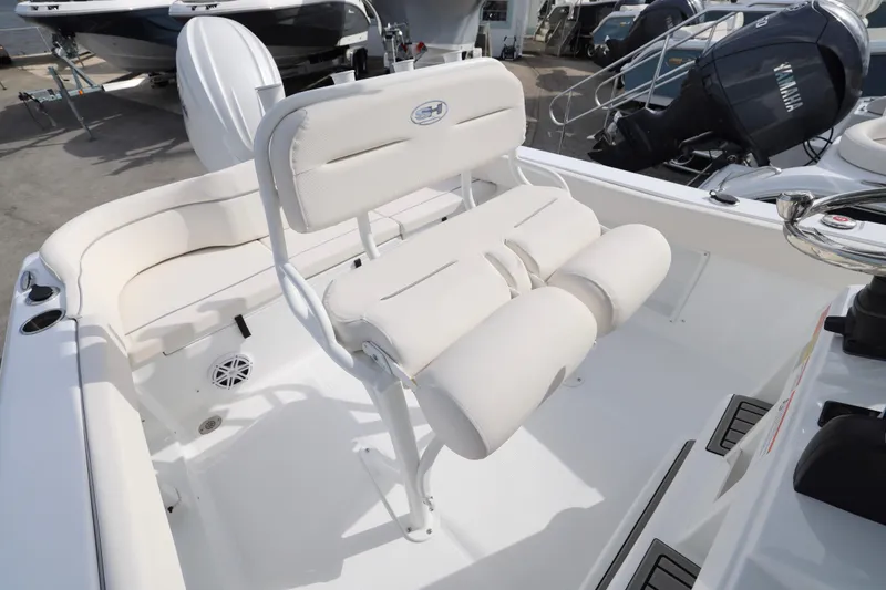 Slide: The Image of 2026 Sea Hunt Ultra 219 boat interior with white seating and Yamaha outboard motor. - 5