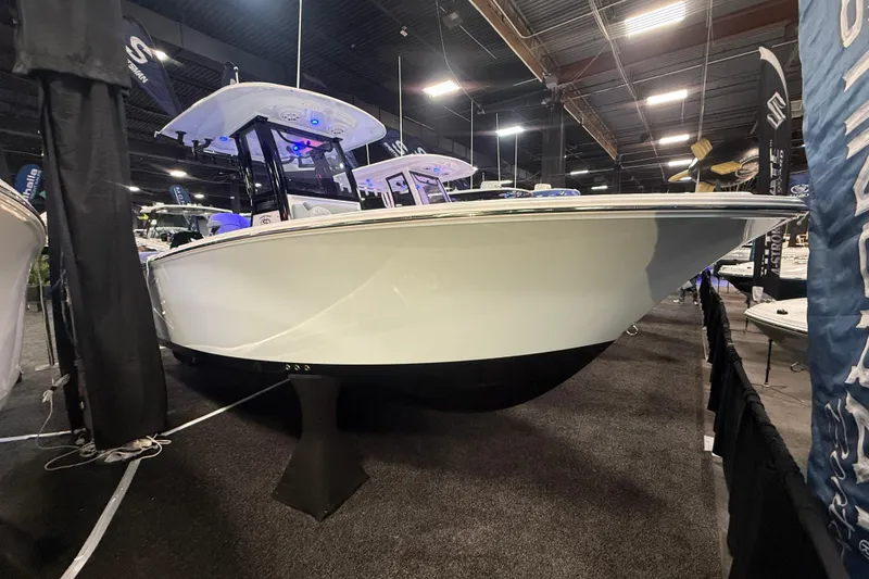 The Image of 2026 Sportsman Heritage 231 Center Console boat displayed at an indoor exhibition. - 0