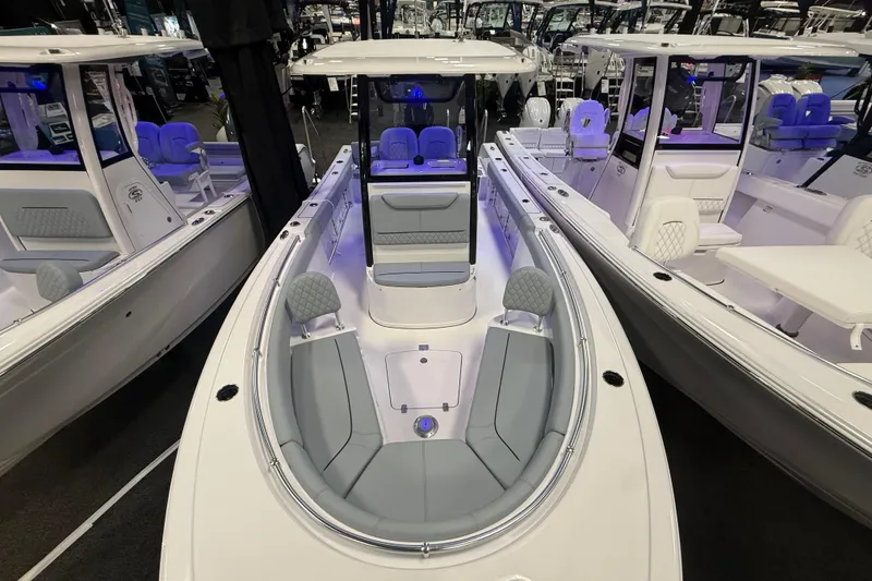 Slide: The Image of 2026 Sportsman Heritage 231 Center Console boat with sleek design and spacious seating. - 10