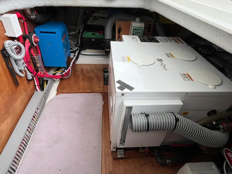 Slide: The Image of Engine room of 2013 Beneteau Swift Trawler 34 with equipment and wiring. - 14