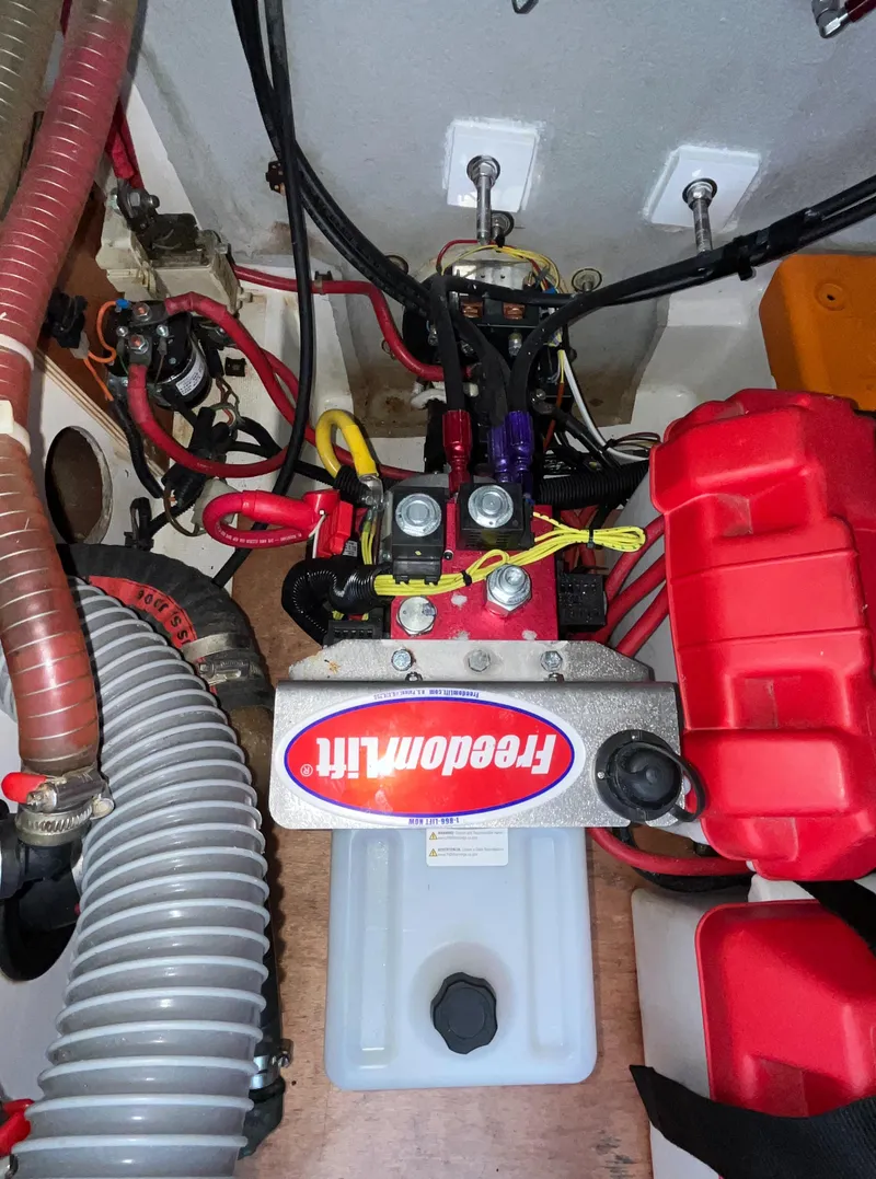 Slide: The Image of Engine compartment of a 2013 Beneteau Swift Trawler 34 with wiring and components. - 19