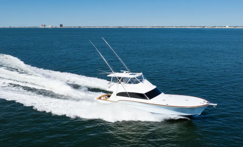 Slide: The Image of 2009 Buddy Davis Sportfish yacht cruising on open sea. - 10