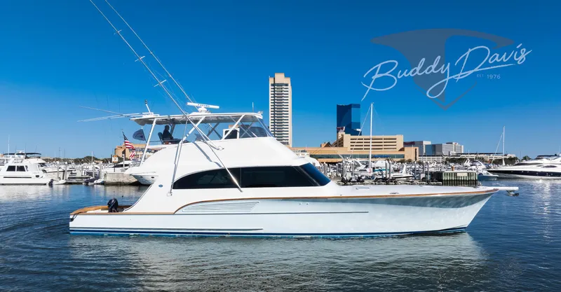 Slide: The Image of 2009 Buddy Davis Sportfish yacht in harbor, blue sky. - 12