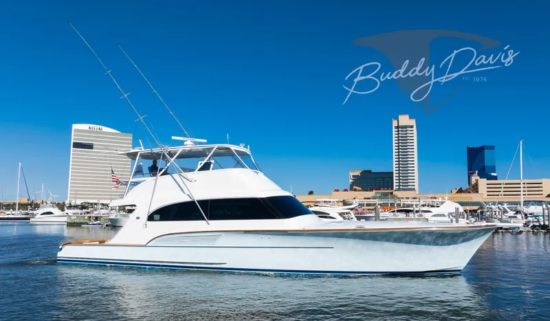 Slide: The Image of 2009 Buddy Davis Sportfish yacht in harbor with city skyline. - 15