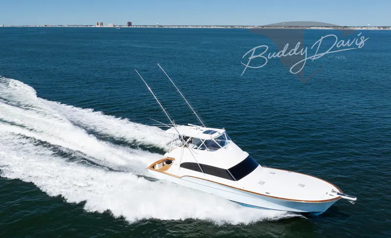 Slide: The Image of 2009 Buddy Davis Sportfish yacht cruising on open sea. - 16