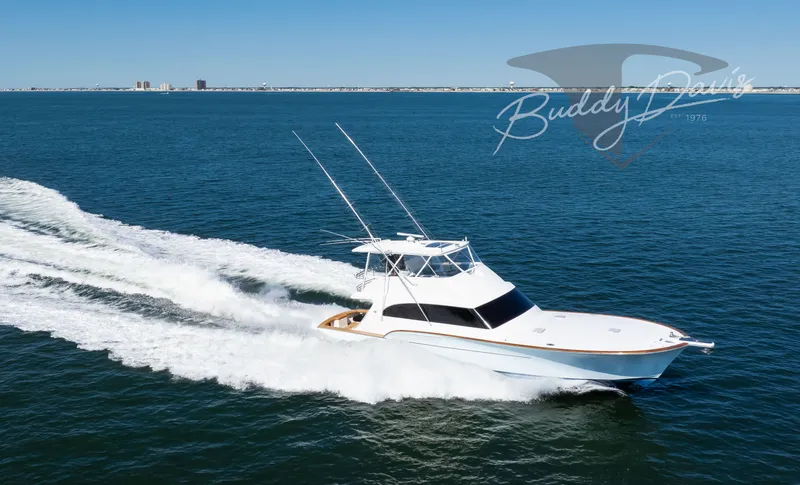 Slide: The Image of 2009 Buddy Davis Sportfish yacht cruising on open sea. - 19
