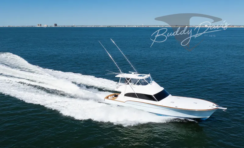Slide: The Image of 2009 Buddy Davis Sportfish yacht cruising on open sea. - 20