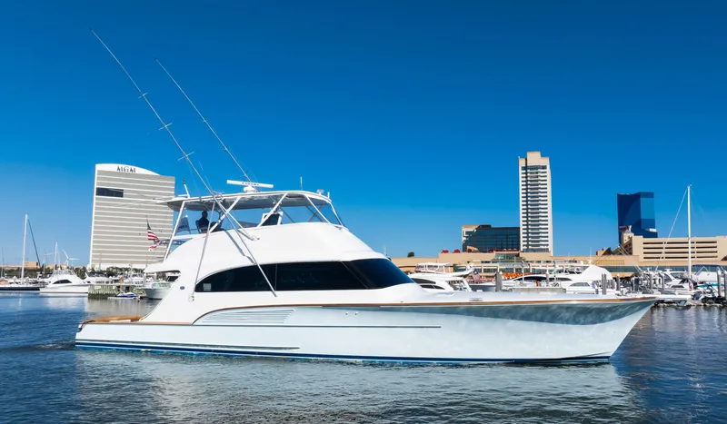 Slide: The Image of 2009 Buddy Davis Sportfish yacht in harbor with city buildings. - 27