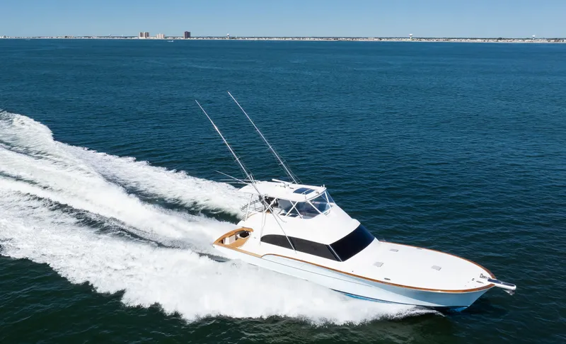 Slide: The Image of 2009 Buddy Davis Sportfish yacht cruising on open sea. - 28