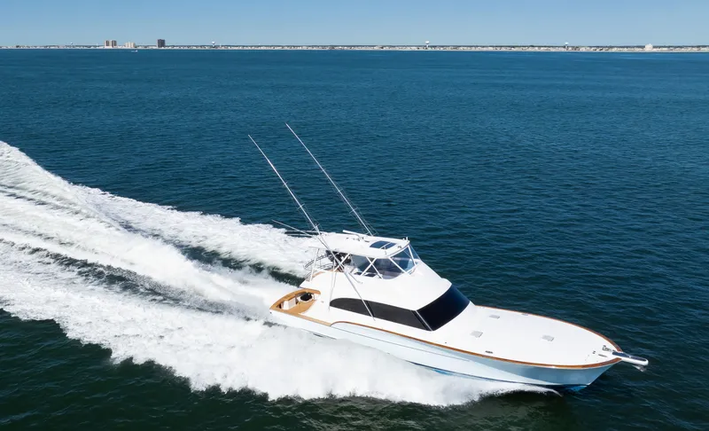 Slide: The Image of 2009 Buddy Davis Sportfish yacht cruising on open sea. - 30