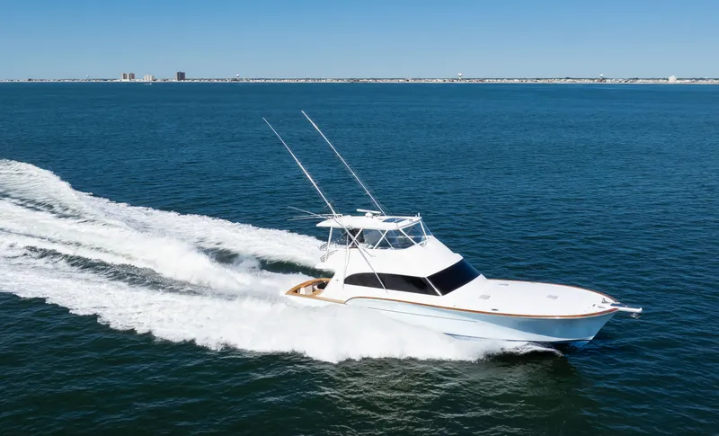 Slide: The Image of 2009 Buddy Davis Sportfish yacht cruising on open sea. - 31