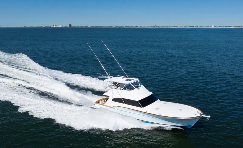 Slide: The Image of 2009 Buddy Davis Sportfish yacht cruising on open sea. - 34