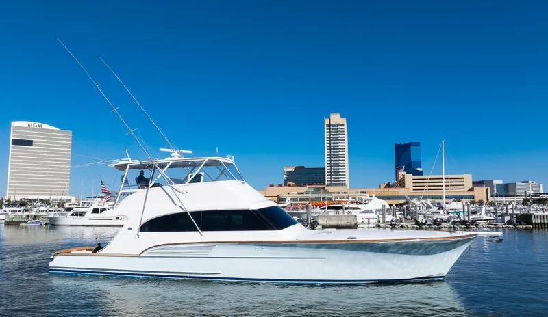 Slide: The Image of 2009 Buddy Davis Sportfish yacht docked in harbor with city skyline. - 5
