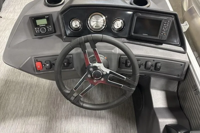 Slide: The Image of 2026 Bennington 20 SLSF boat dashboard with steering wheel and control panel. - 11