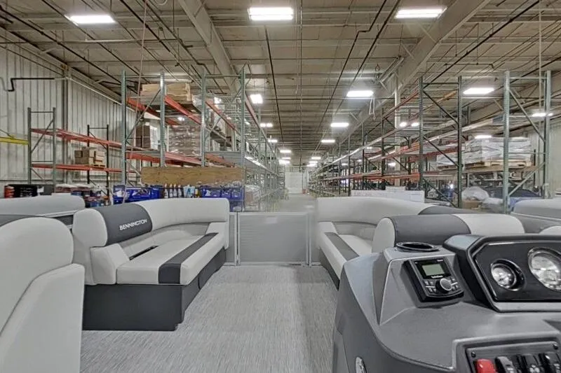 Slide: The Image of Interior view of a 2026 Bennington 20 SLSF - SNAP pontoon boat in a warehouse. - 15
