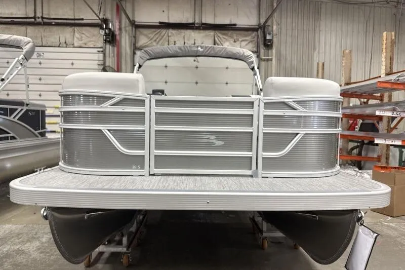 Slide: The Image of 2026 Bennington 20 SLSF pontoon boat in a warehouse setting. - 3