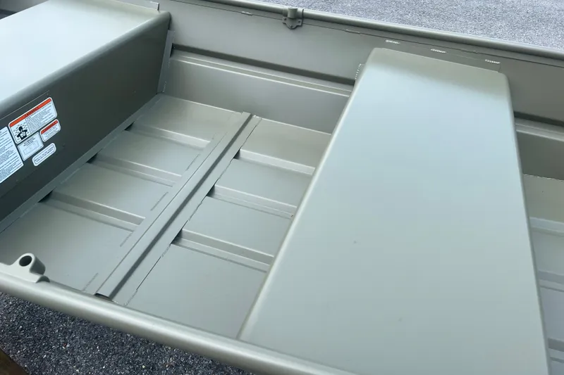 Slide: The Image of Interior view of 2026 Tracker Grizzly 12 Jon boat, showcasing seating and storage area. - 7