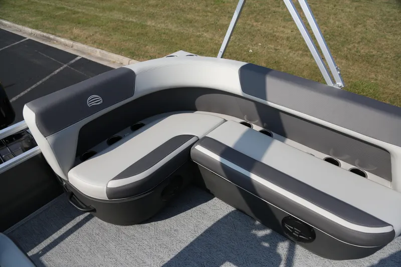 Slide: The Image of 2026 Sun Tracker Bass Buggy 16 XL Select boat seating with cup holders, gray upholstery. - 4