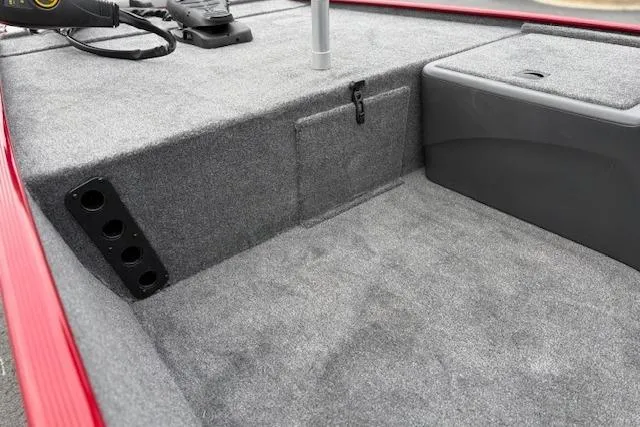 Slide: The Image of 2026 Tracker Bass Tracker Classic XL interior with gray carpet and storage compartments. - 84