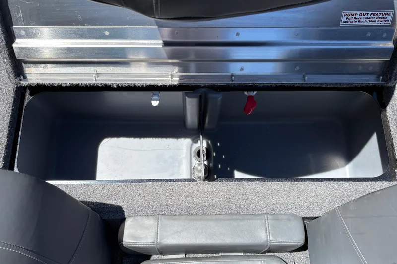 Slide: The Image of 2026 Tracker Pro Team 190 boat storage compartment with pump-out feature. - 27