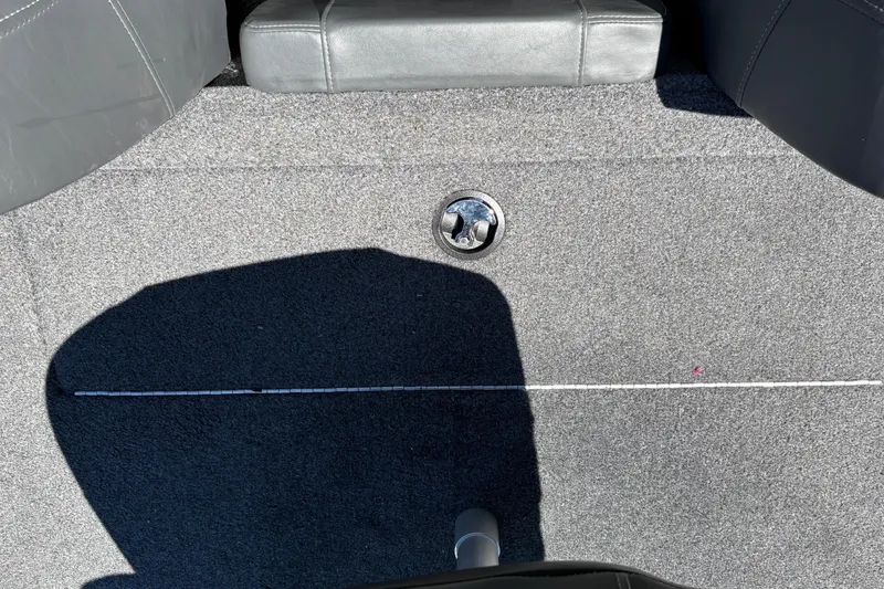 Slide: The Image of Carpeted deck of 2026 Tracker Pro Team 190 boat with seat shadow. - 28
