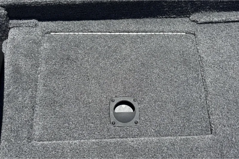Slide: The Image of Carpeted deck of 2026 Tracker Pro Team 190 boat with storage hatch. - 39