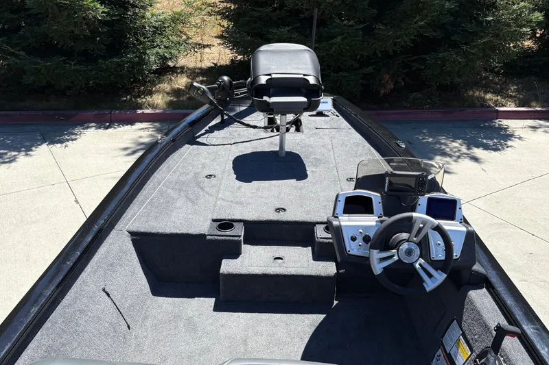Slide: The Image of 2026 Tracker Pro Team 190 boat interior with steering wheel and seating. - 14