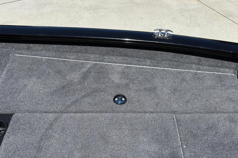 Slide: The Image of 2026 Tracker Pro Team 190 boat deck with gray carpet and metal cleat. - 35