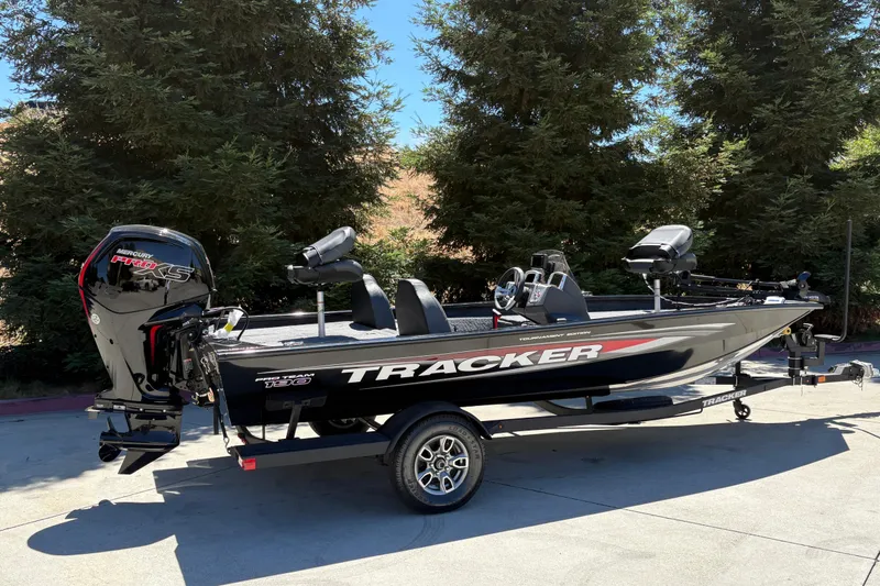 Slide: The Image of 2026 Tracker Pro Team 190 boat with Mercury Pro XS engine, parked outdoors. - 5