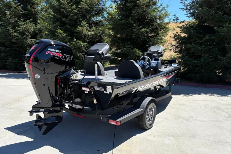 Slide: The Image of 2026 Tracker Pro Team 190 boat with Mercury Pro XS engine, parked outdoors. - 9