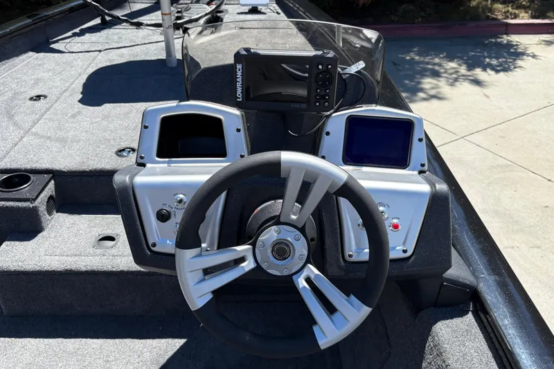 Slide: The Image of Steering console of 2026 Tracker Pro Team 190 boat with navigation equipment. - 17