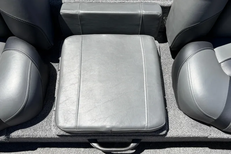 Slide: The Image of Gray seating area of 2026 Tracker Pro Team 190 boat, featuring cushioned seats. - 30
