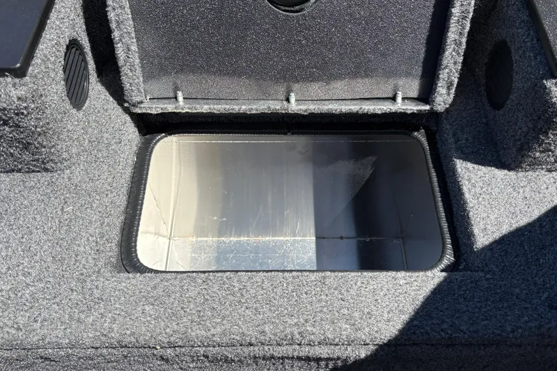 Slide: The Image of Open storage compartment in 2026 Tracker Pro Team 190 boat. - 31