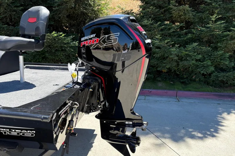 Slide: The Image of 2026 Tracker Pro Team 190 boat with Mercury Pro XS engine, parked outdoors. - 12