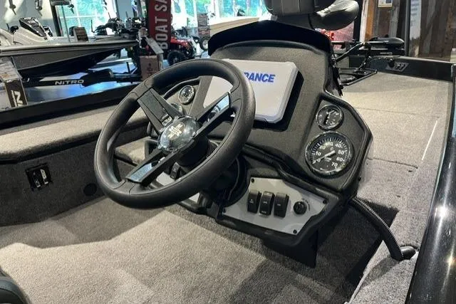 Slide: The Image of 2026 Ranger RT178 boat dashboard with steering wheel and control panel. - 4